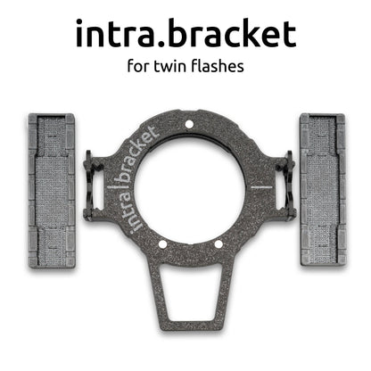 Intra bracket for twin flashes with 'intra.bracket' branding on a white background