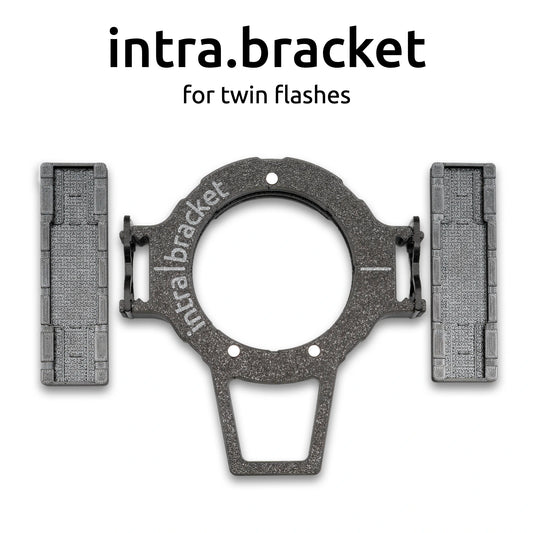 Intra bracket for twin flashes with 'intra.bracket' branding on a white background